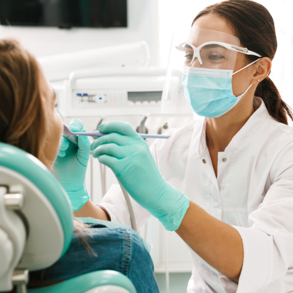 Female dentist working on patient Female dentist working on patient